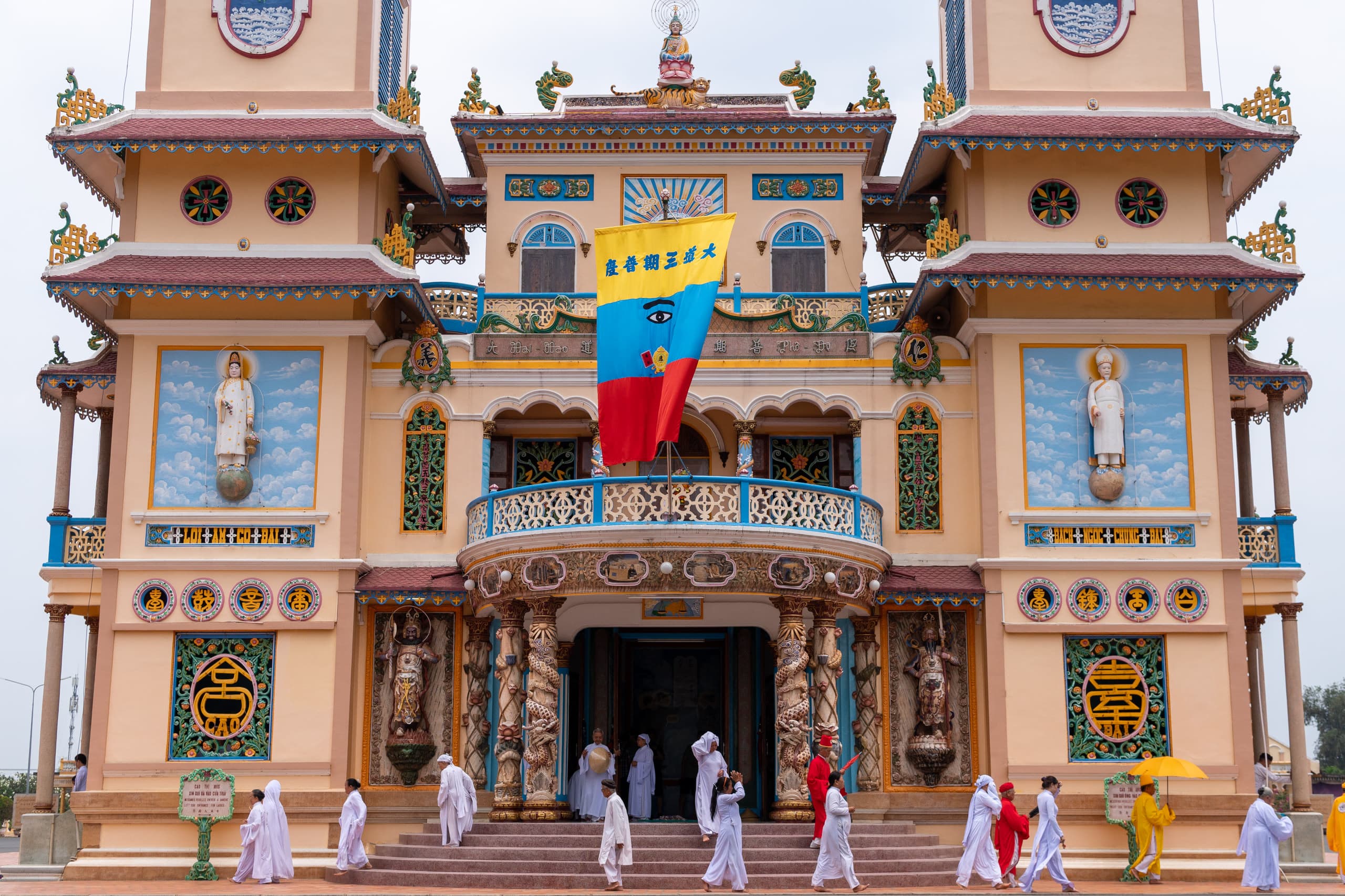 Worshippers exiting a Cao Dai temple