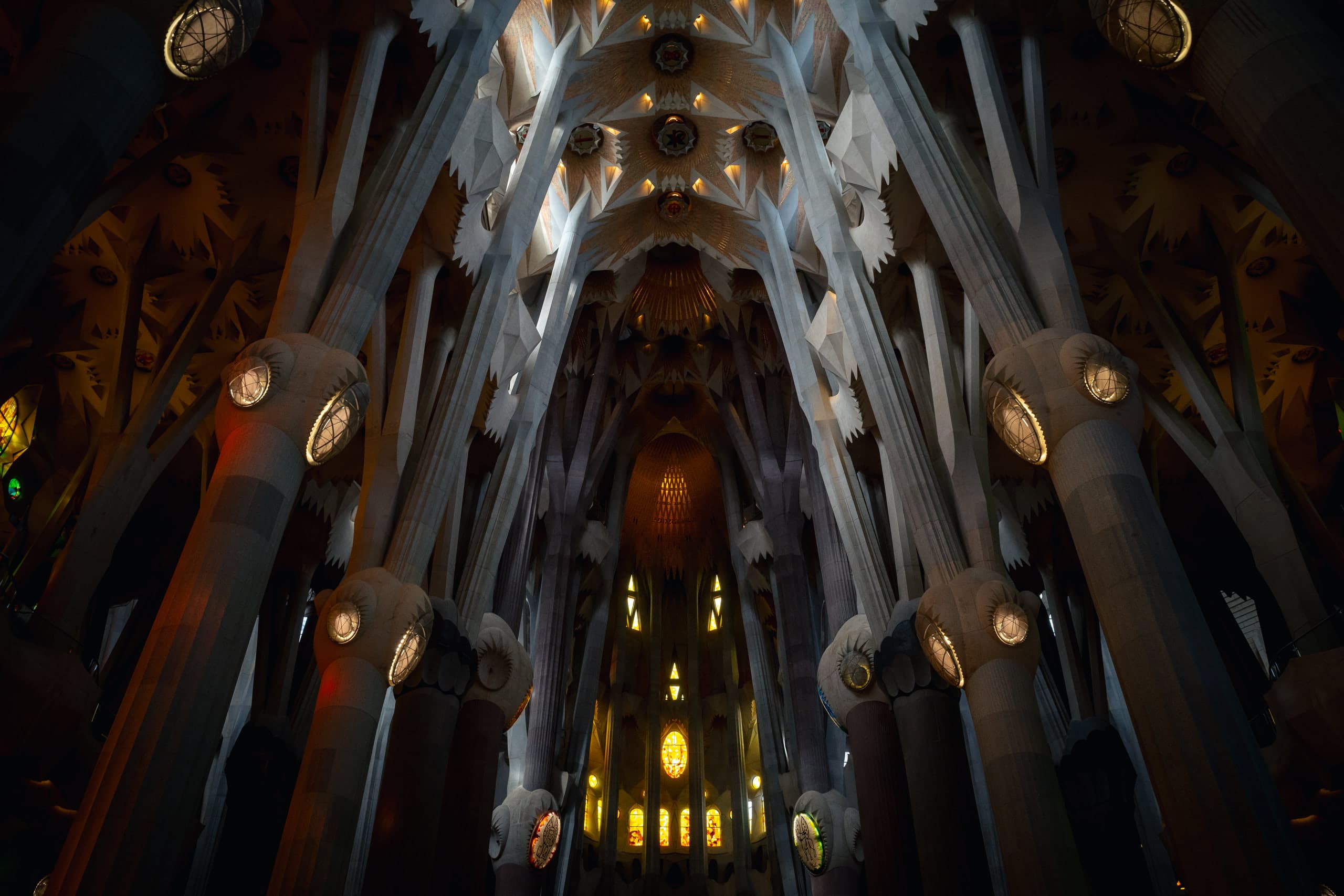 Inside of a church with ornate pillars and ceiling