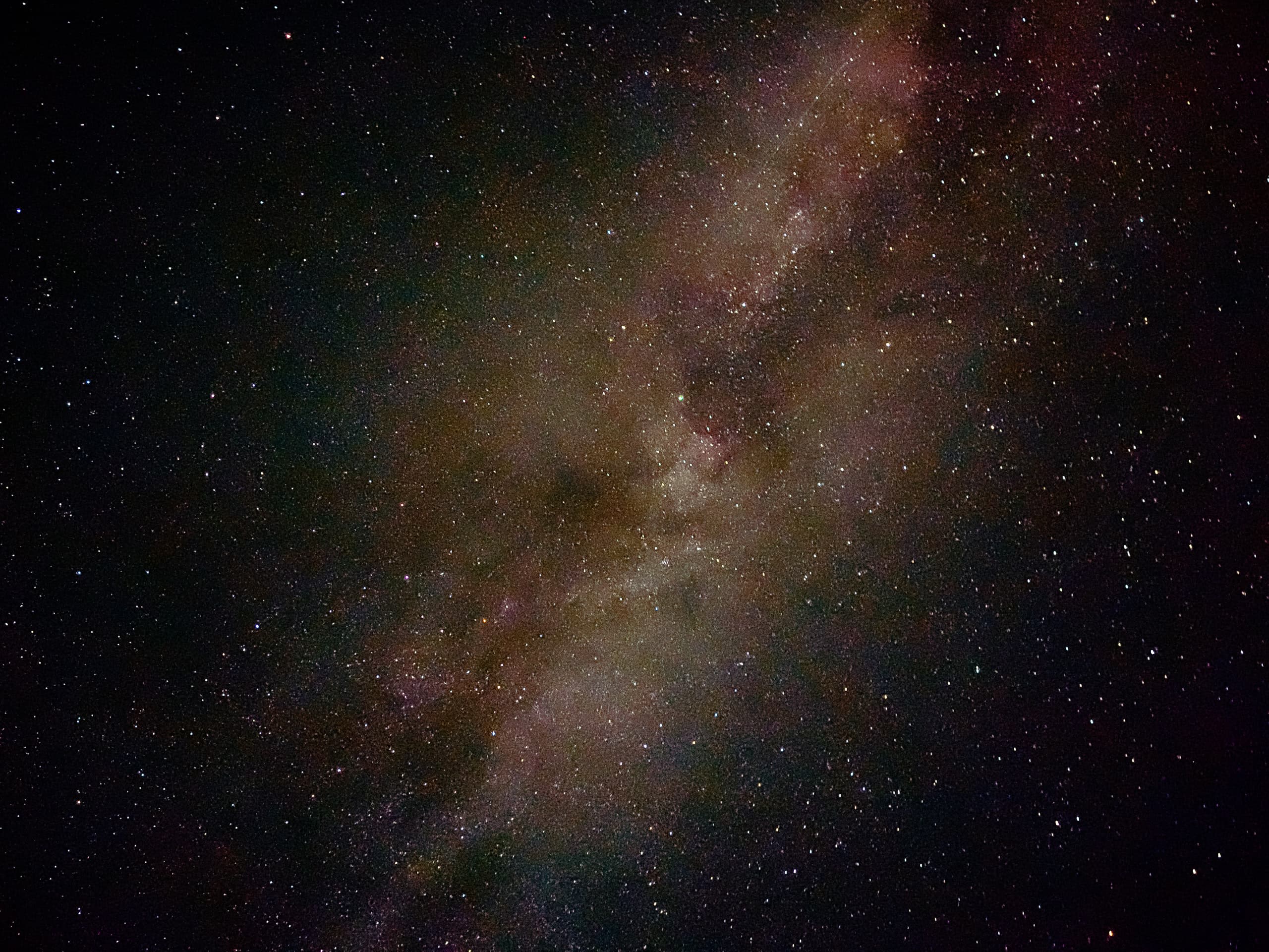 Night sky full of stars and the Milky Way galaxy in the center
