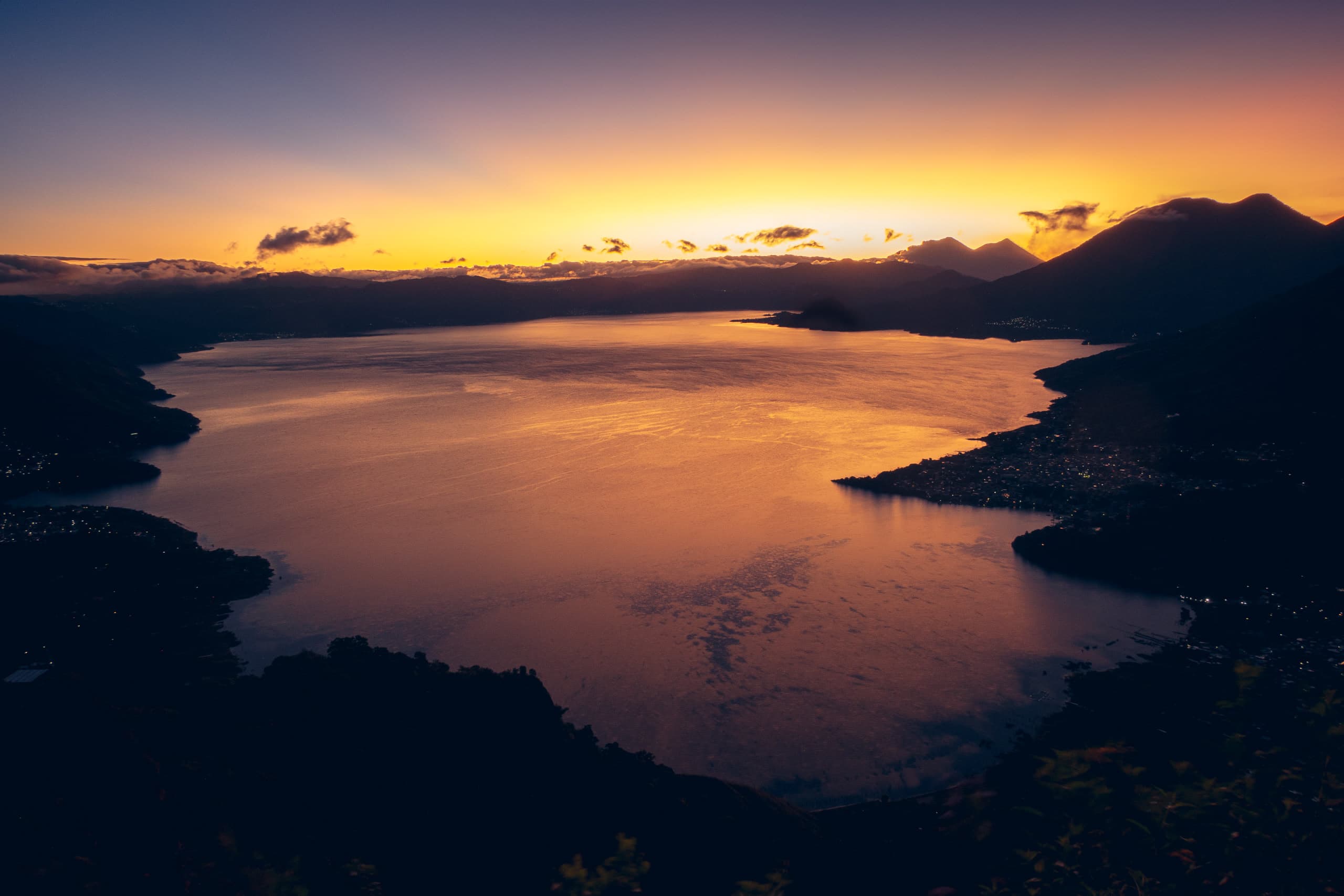 Sunrise in a lake surrounded by volcanoes