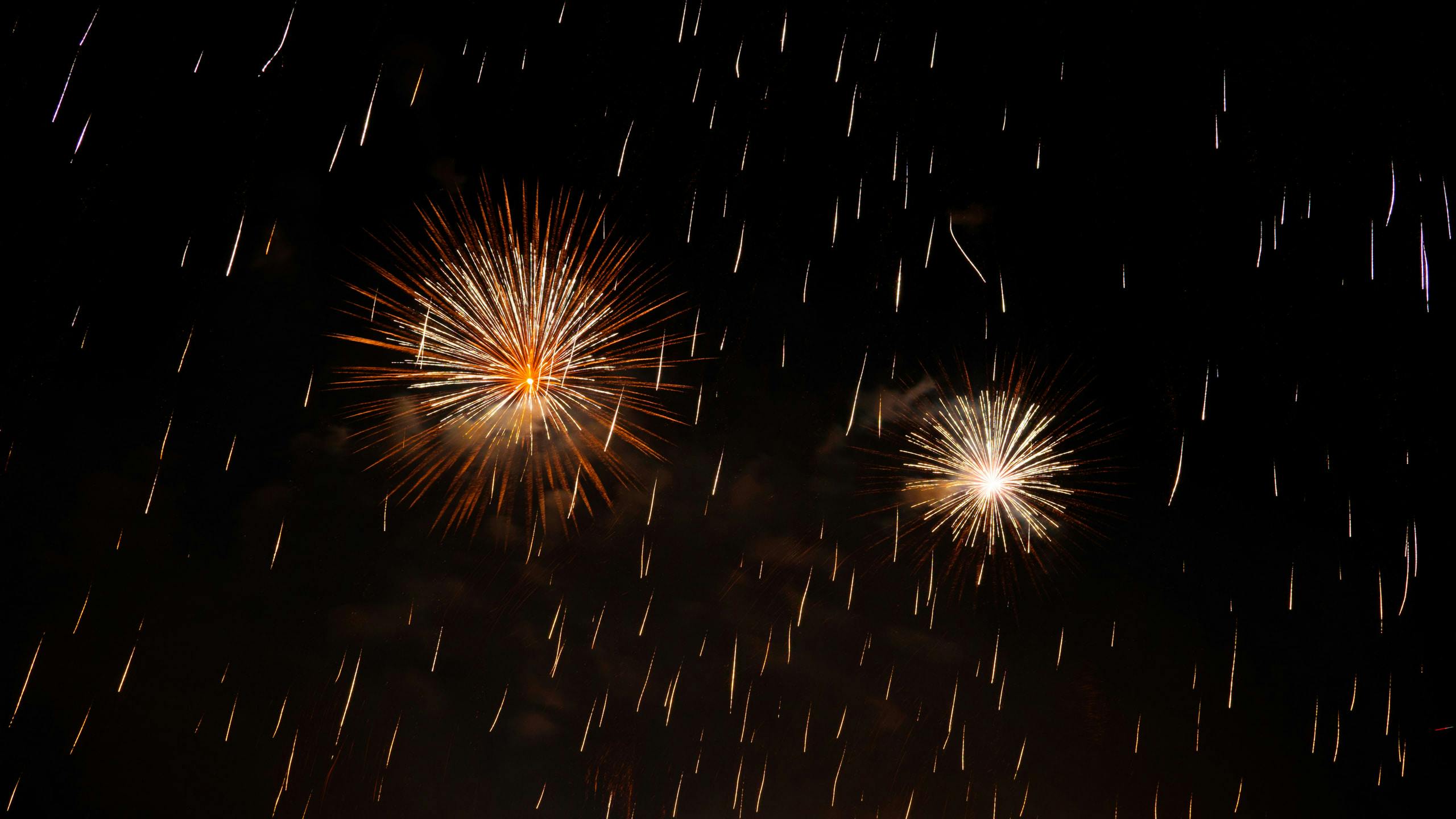 Fireworks with rainy strokes of sparks falling down