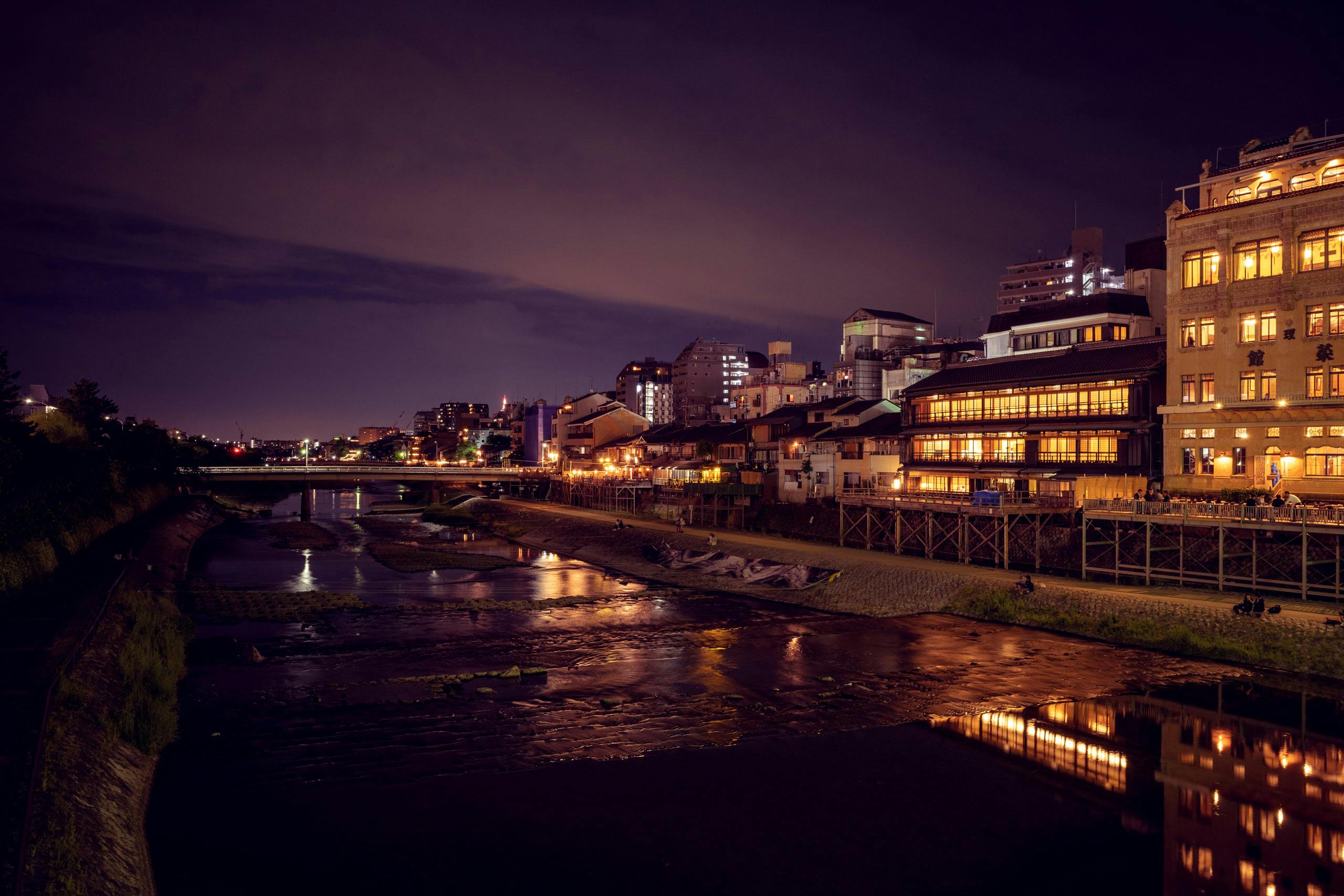 A riverfront in Kyoto at night